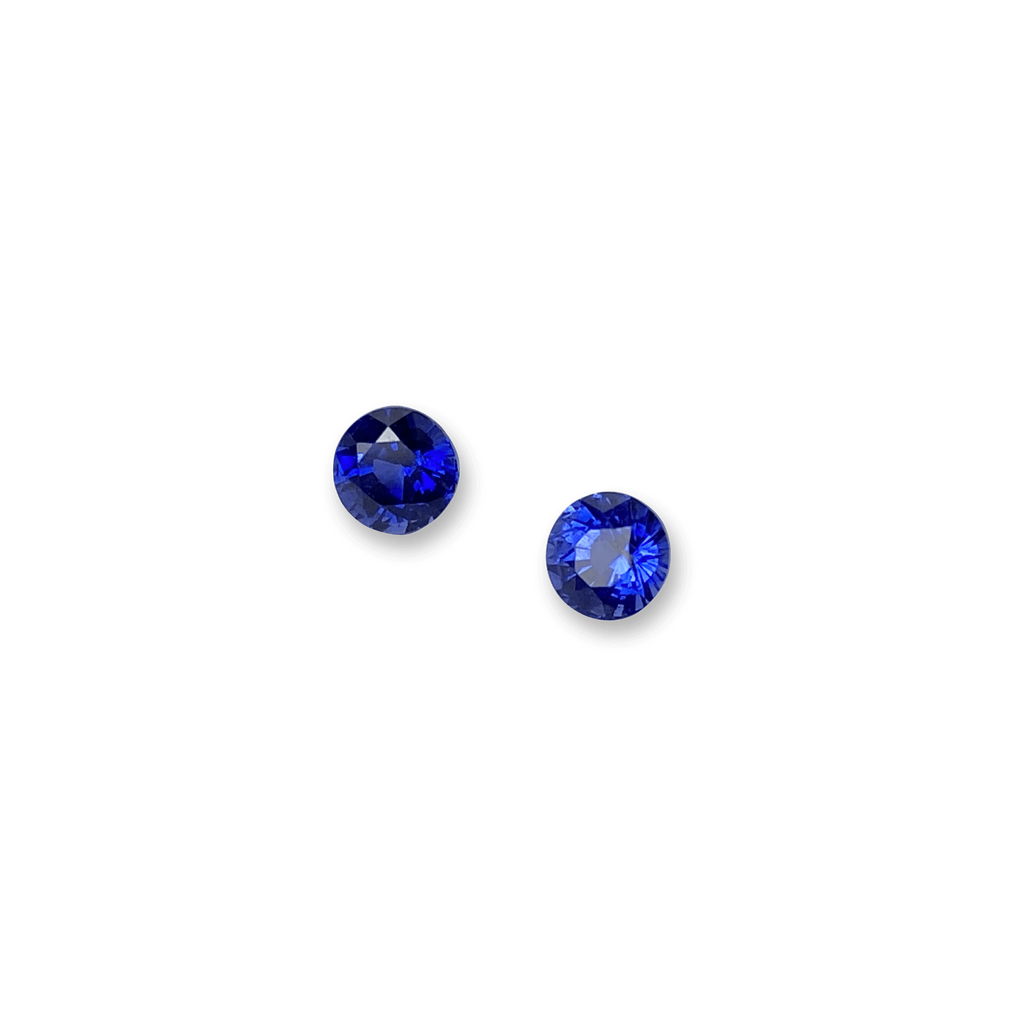 Elegant blue sapphire pair showcasing vibrant, deep blue hues with brilliant faceting, perfect for fine jewellery or gemstone collections.