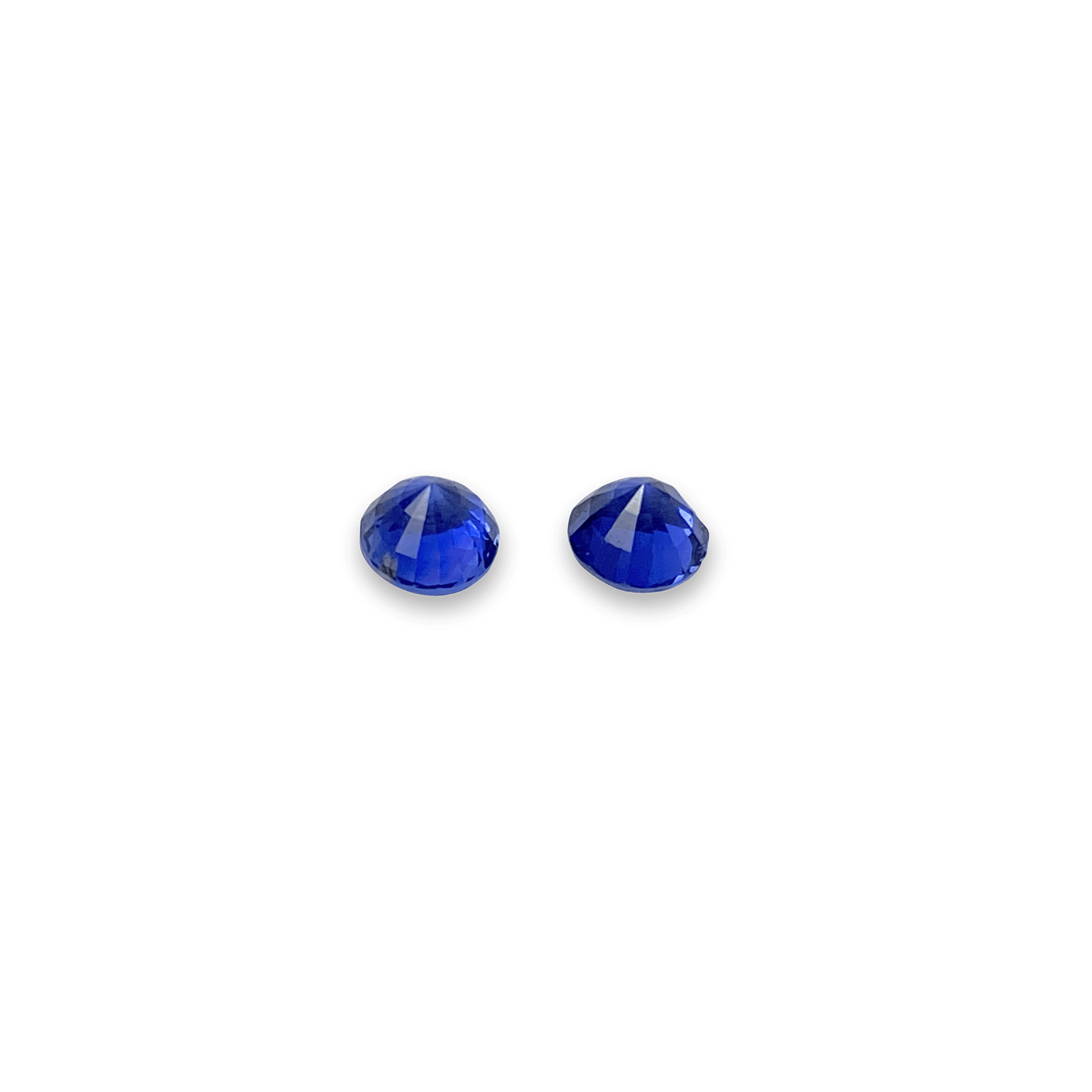 Elegant blue sapphire pair showcasing vibrant, deep blue hues with brilliant faceting, perfect for fine jewellery or gemstone collections.