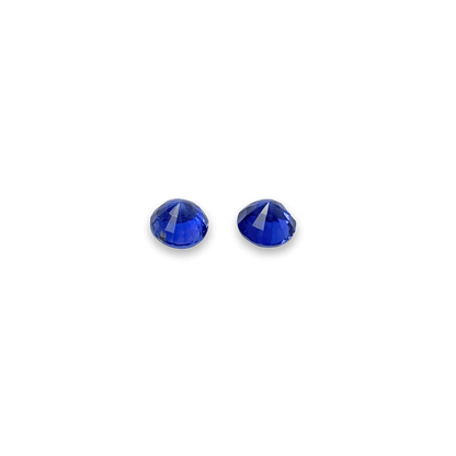 Elegant blue sapphire pair showcasing vibrant, deep blue hues with brilliant faceting, perfect for fine jewellery or gemstone collections.